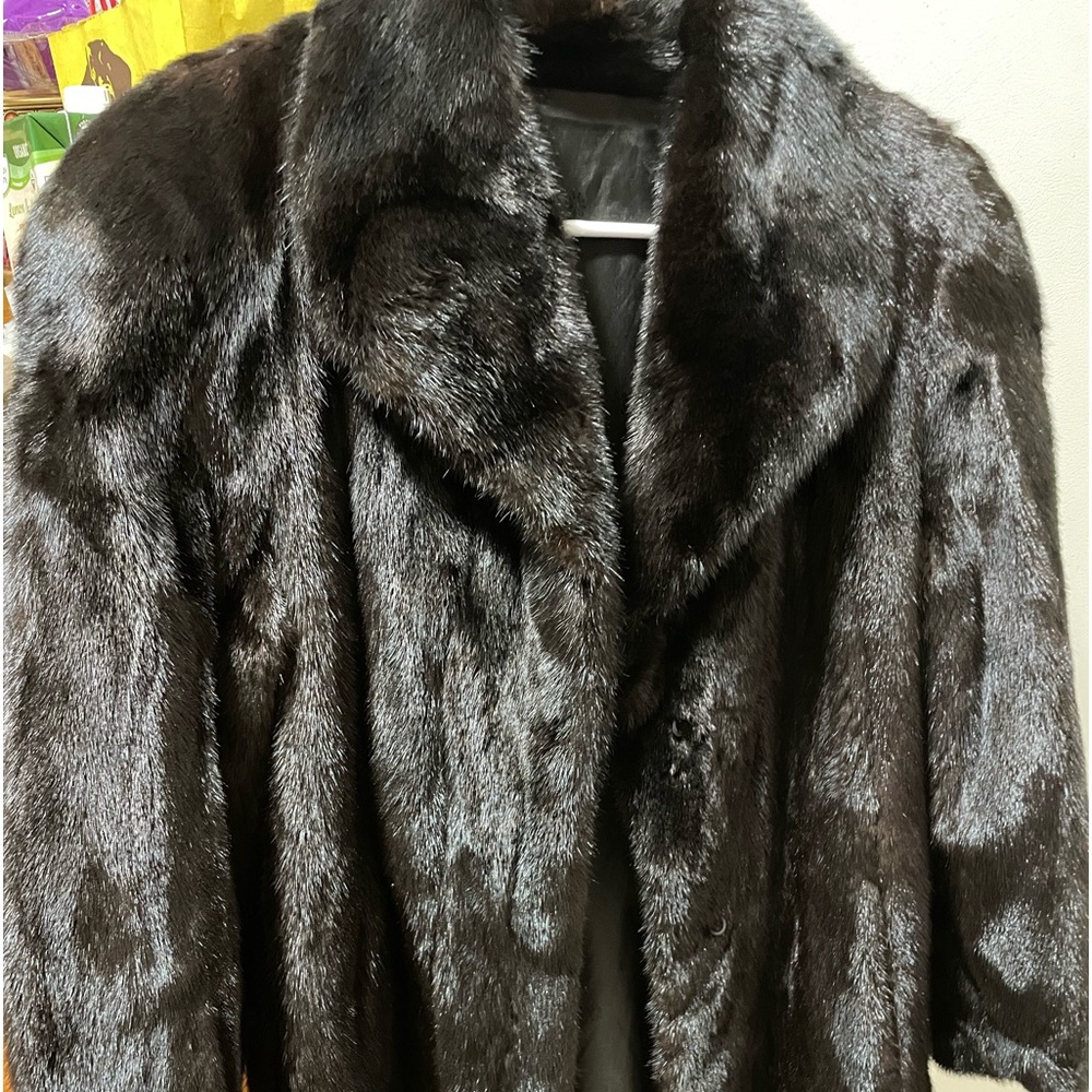 Mink coat size 8 very cozy, in superb cond, 3/4 long, inside and outside pockets
